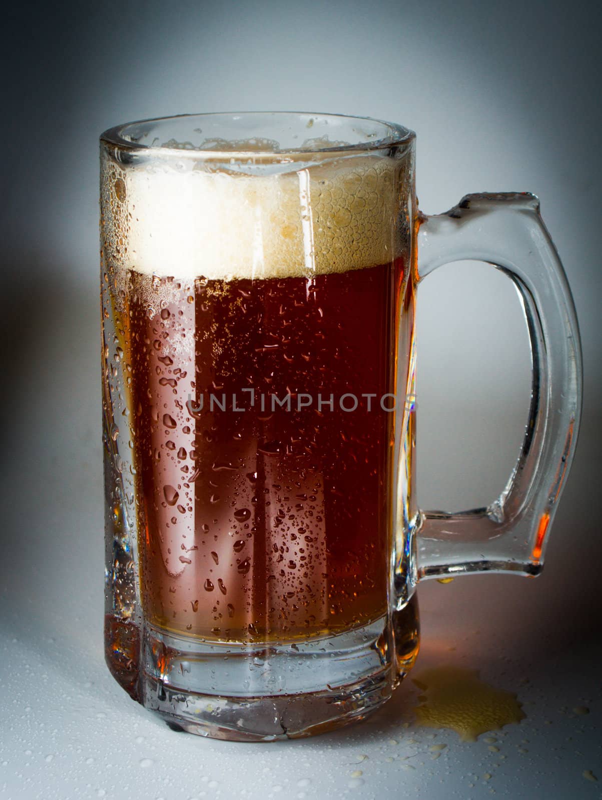Beer glass full of cold dark beer. Isolated