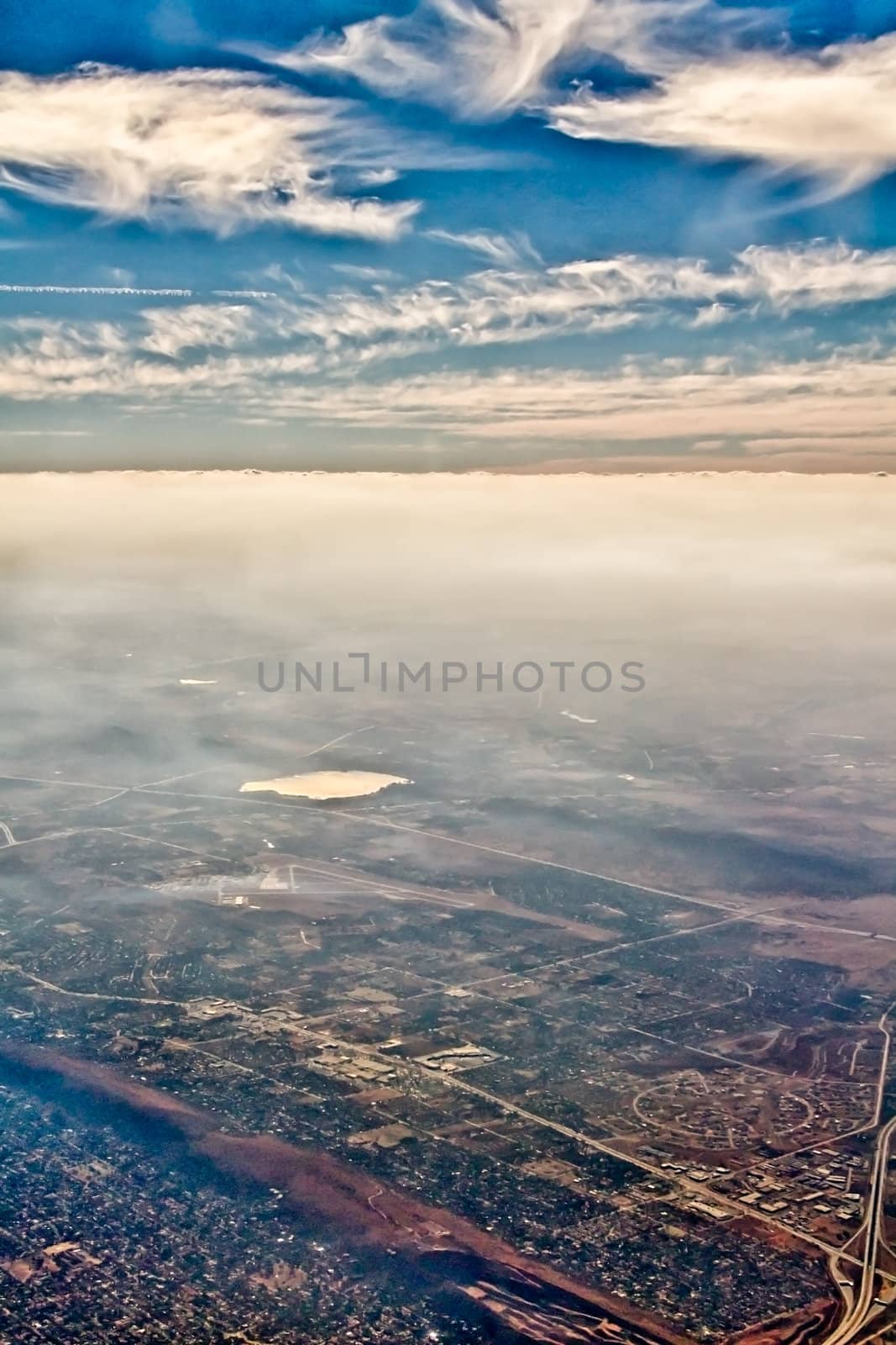 Beautiful clouds forming a mystical and dreamy cloudscape 30000 feet in the air