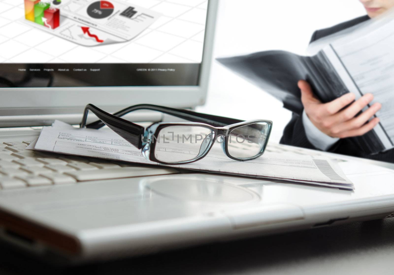 Businessman analyzing a contract at office with selective focus on glasses-NOTE:All elements used for this collage are created by me.You can see some of the photos used in my galery