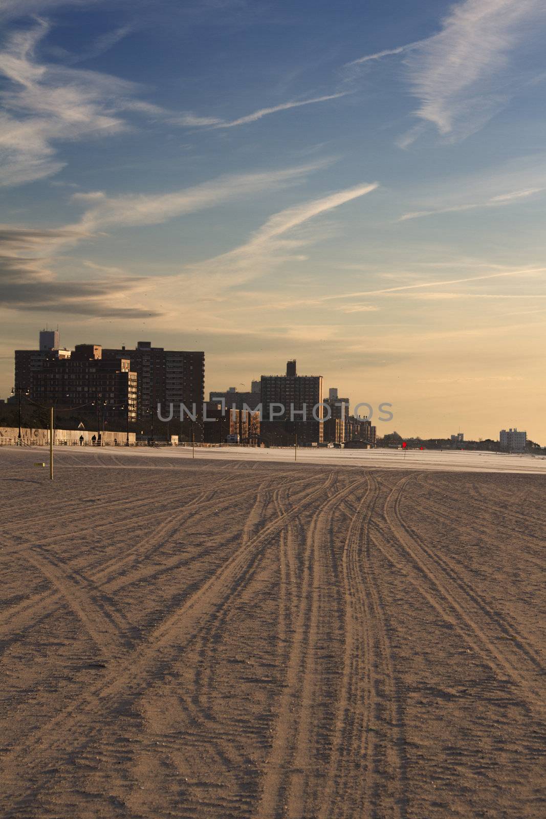 Coney Island beach at sunrise with building in the background