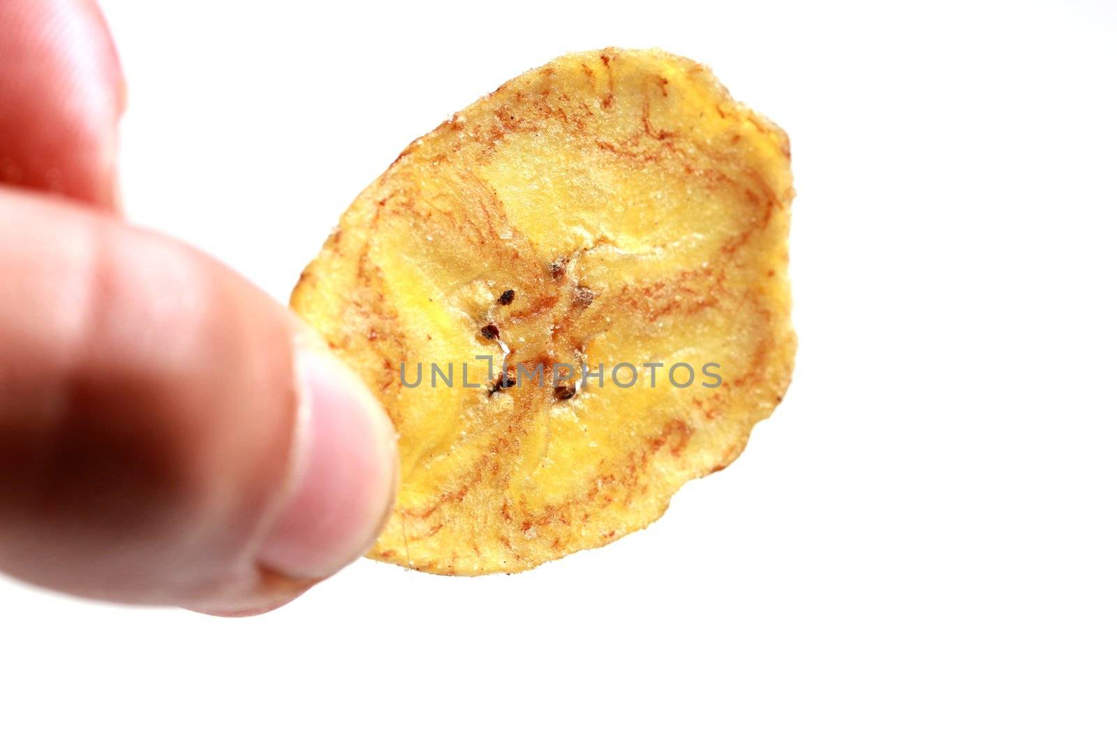 banana chip in hand