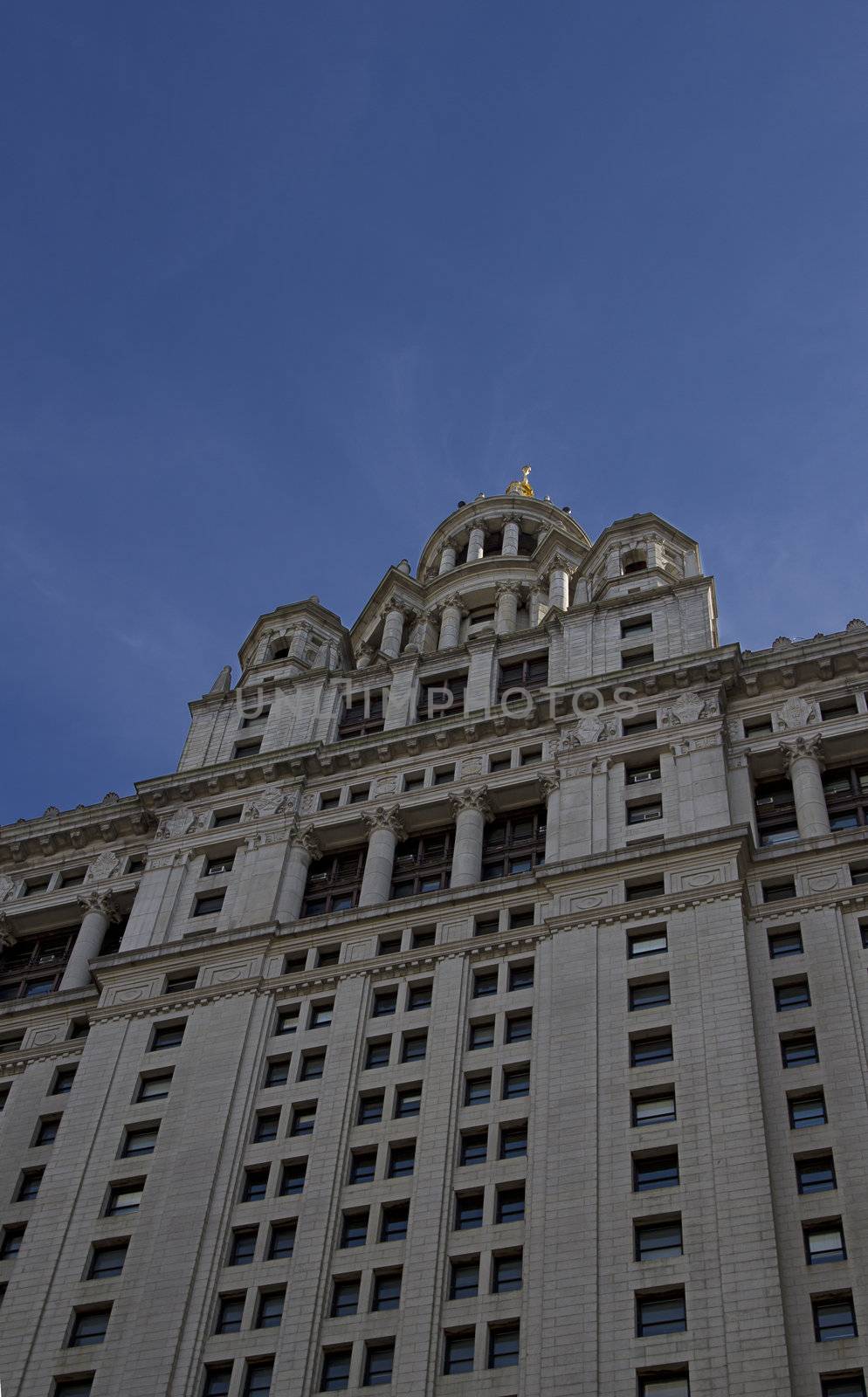 Closeup view of New York city town hall against a blue sky