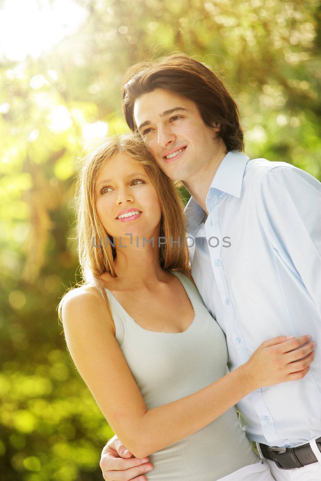 a young couple in love walking in the park