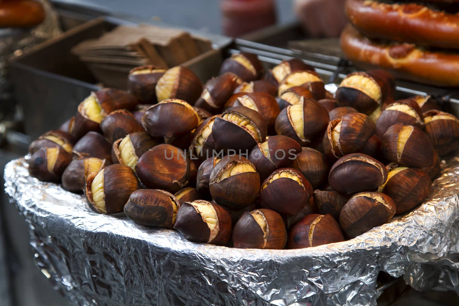 bowl of roasted chesnut on street seller counter