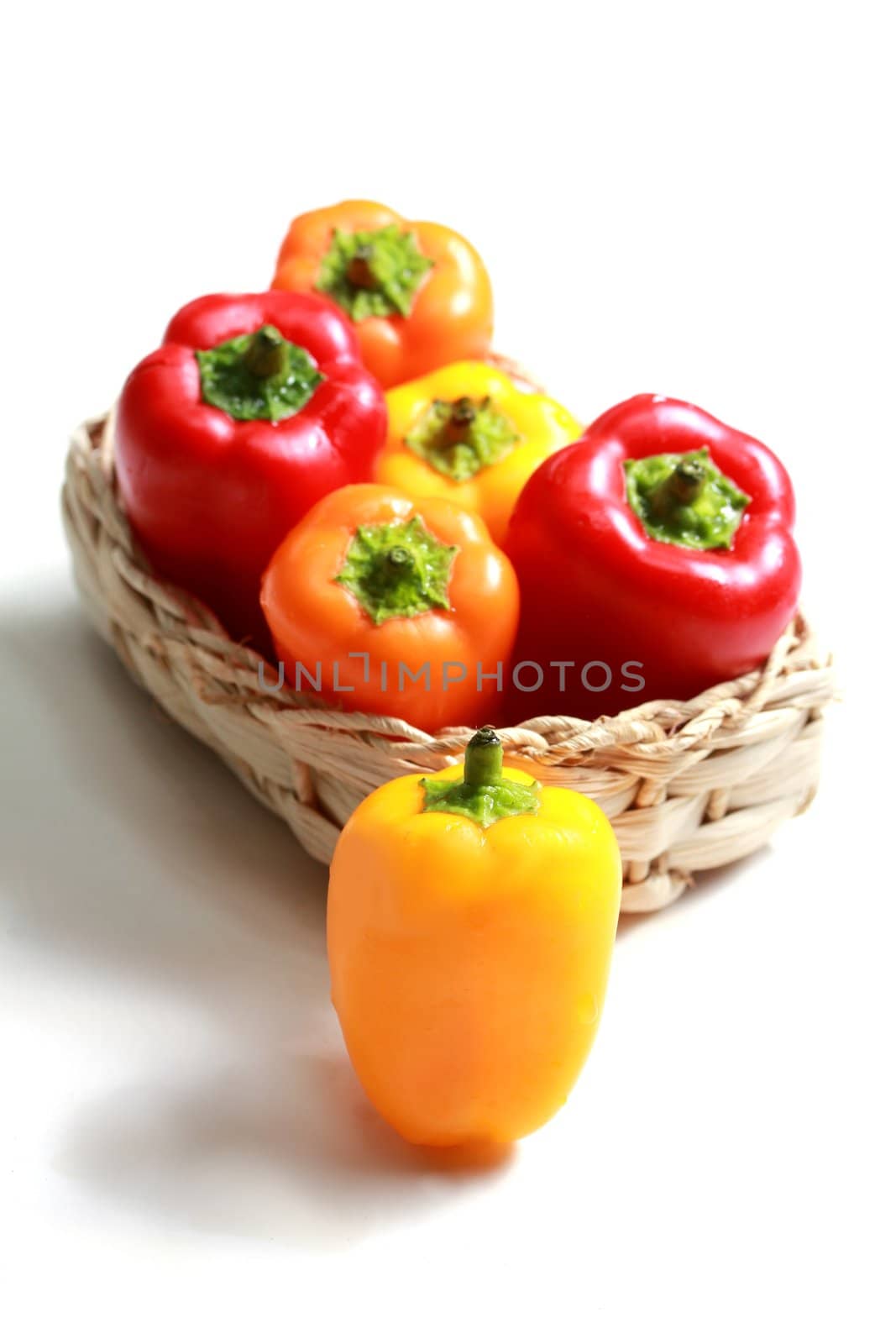 colorful mini paprika in a woven basket