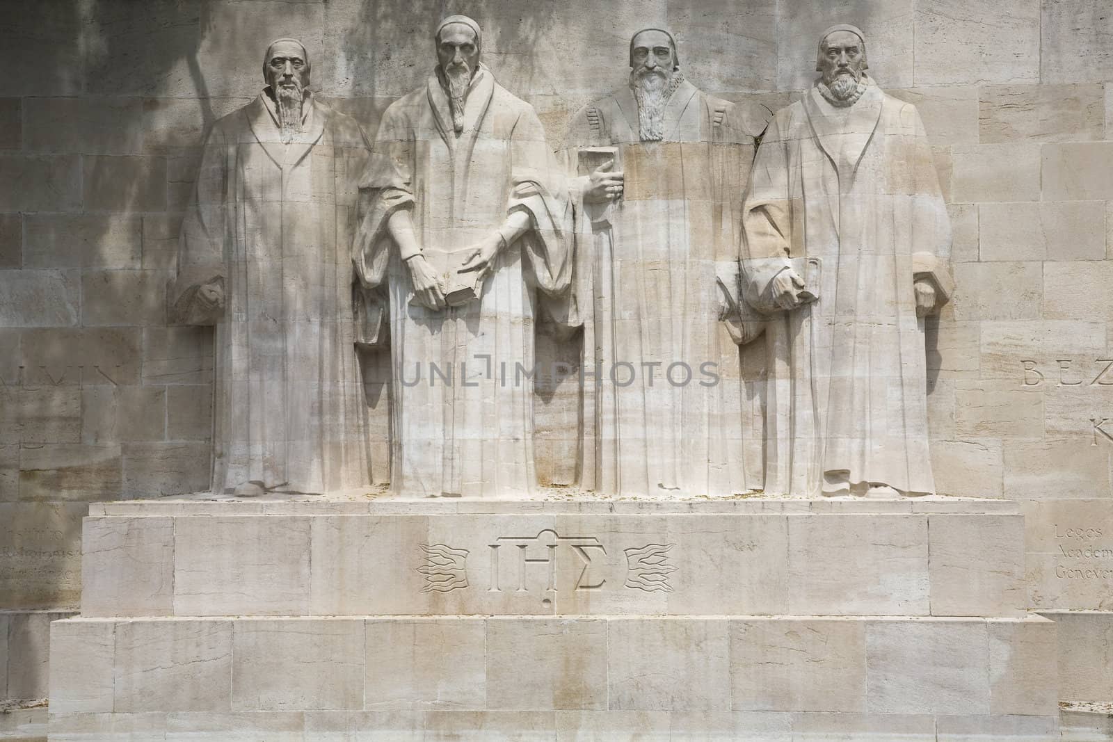 The four reformists commemorated on a wall in Parc Des Bastions in Geneva, Switzerland.  Depicted are William Farel, John Calvin, Theodore de Beze and John Knox.  These statues are more than 15 feet high each.