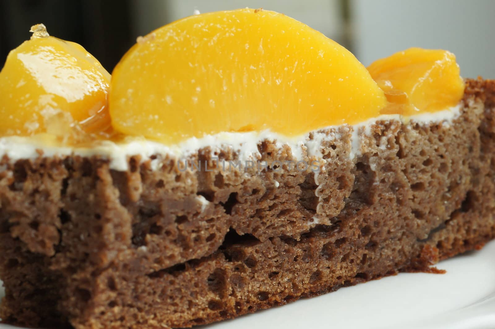 the chocolate biscuit with a peach close up