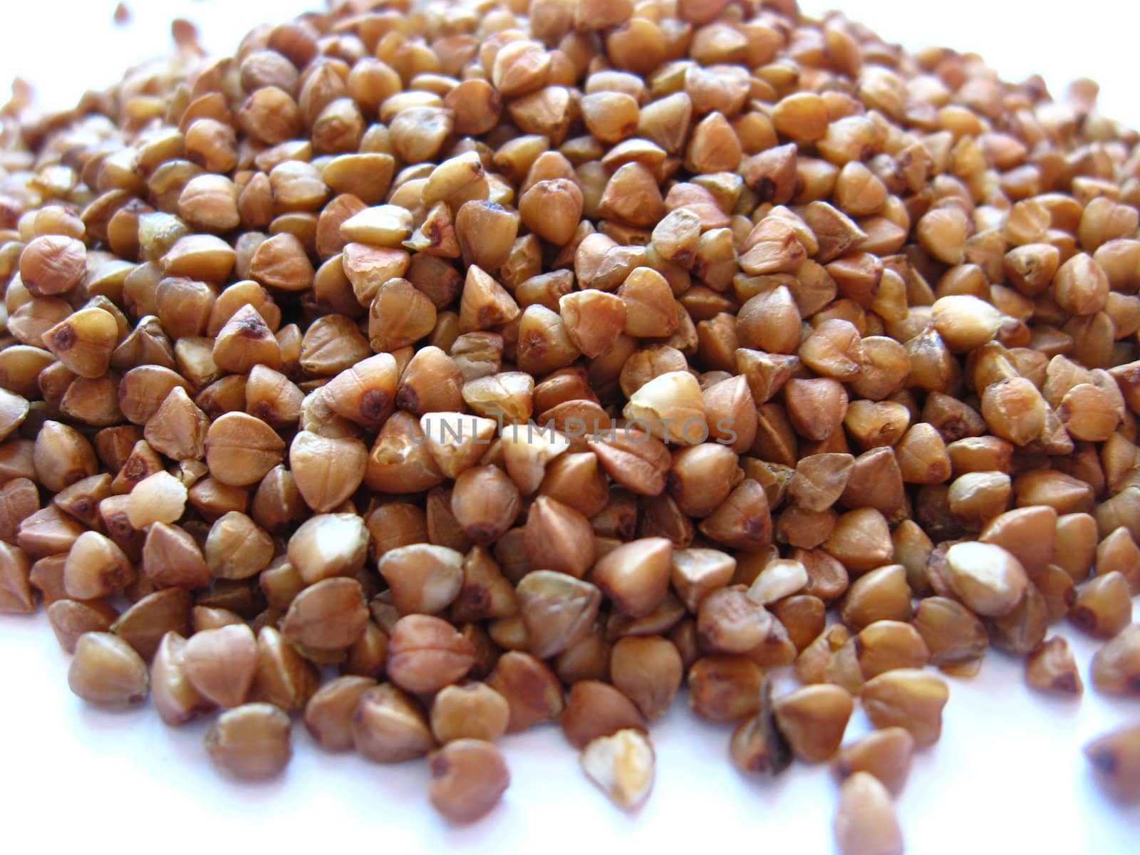 Grains of buckwheat on a white background