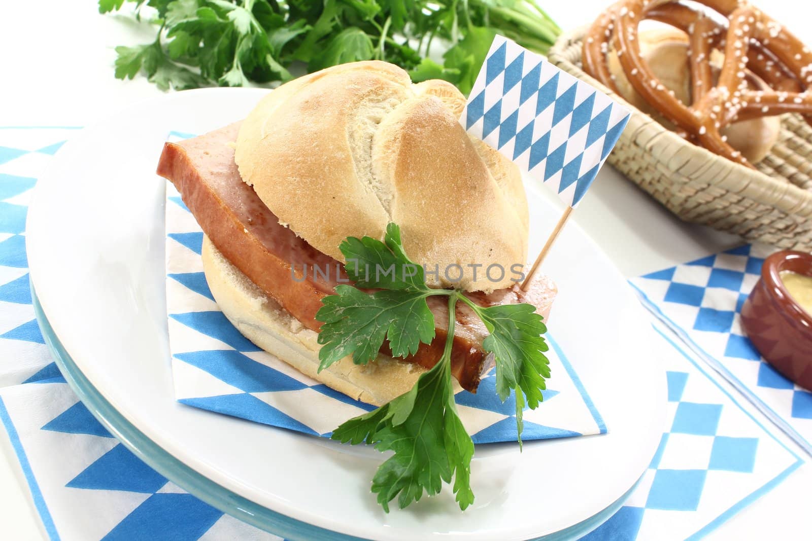 Roll with fried beef and pork loaf, parsley, Bavarian flag on a bright background