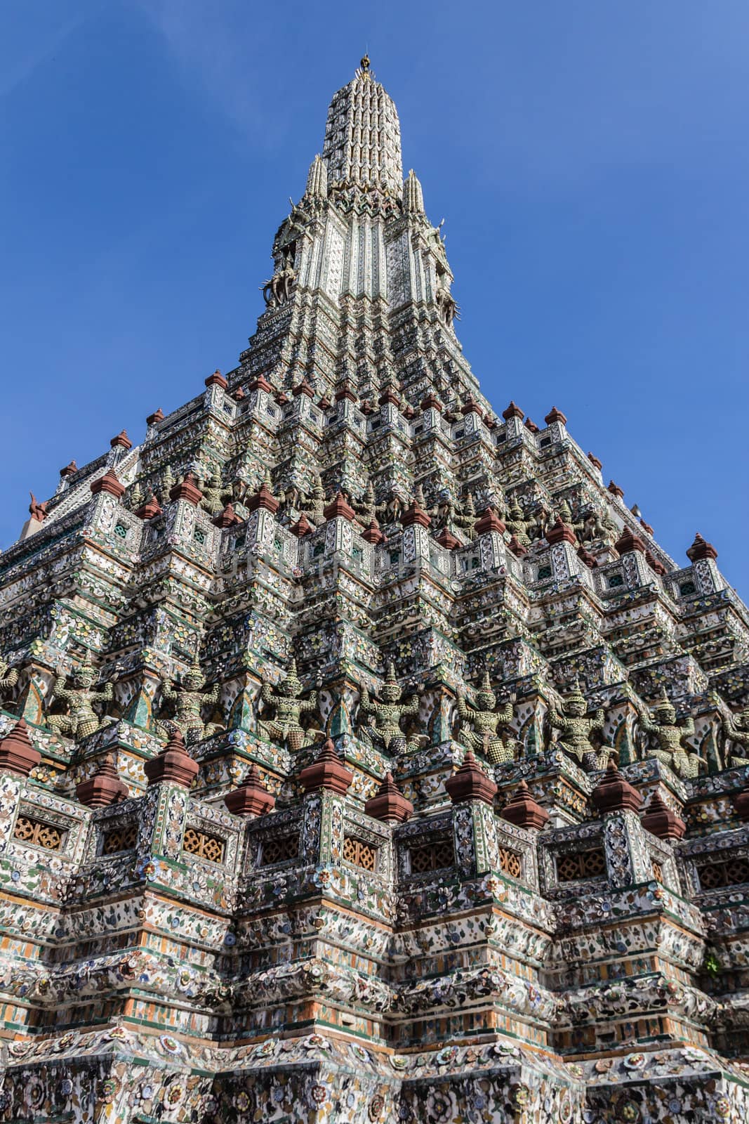 The Temple of Dawn, Wat Arun, Bangkok, Thailand in blue sky background. by punpleng
