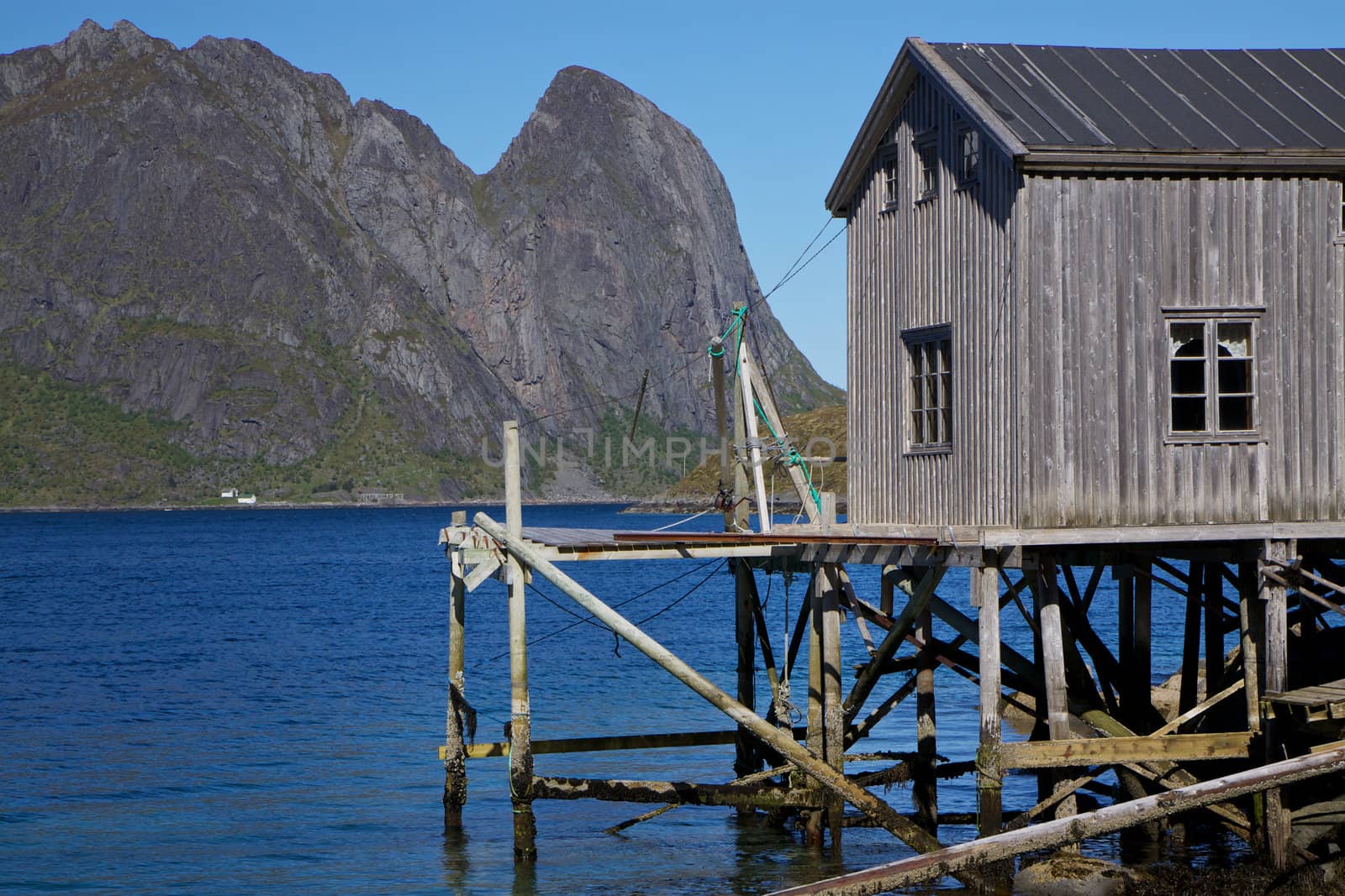 Old detoriated fishing port by the fjord on Lofoten islands in Norway