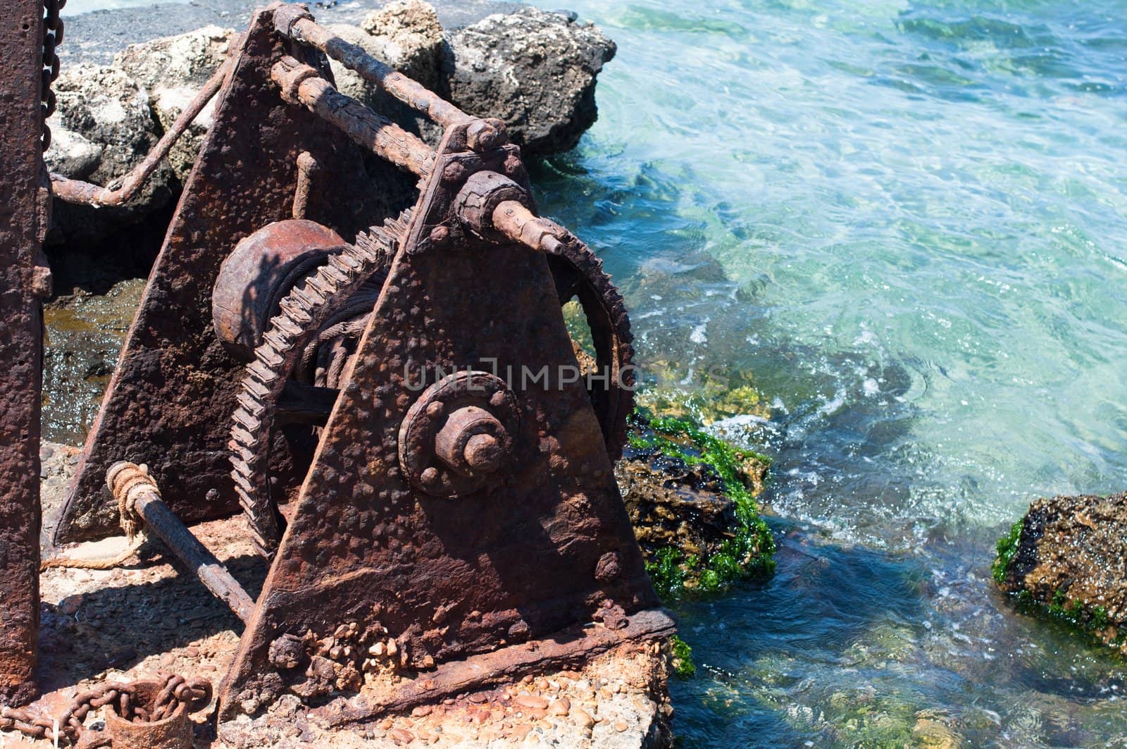 Old winch at a harbour on Crete Island, Greece