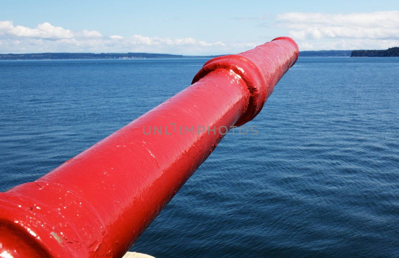 Bright red Tugboat Fire fighting Nozzle with Puget Sound in the background