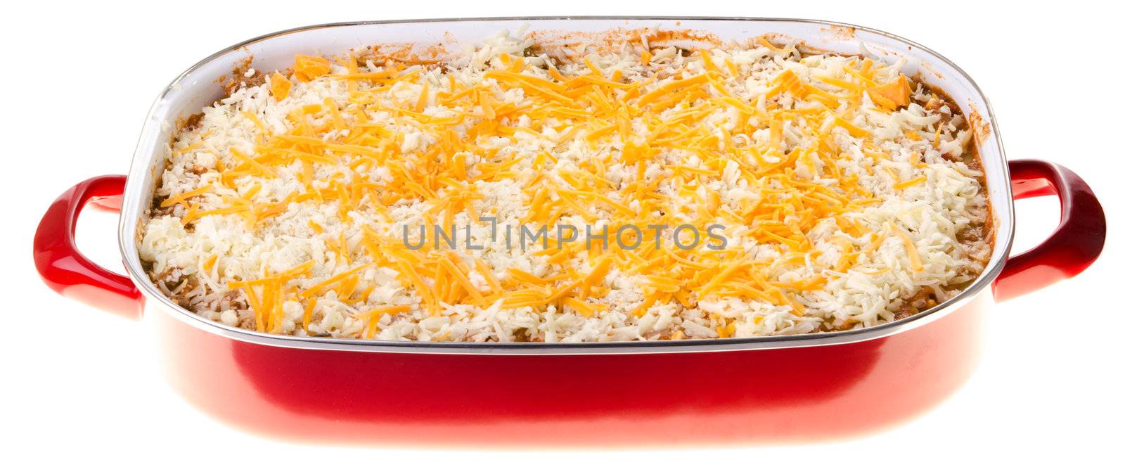 A dish of uncooked lasagna isolated against a white background.