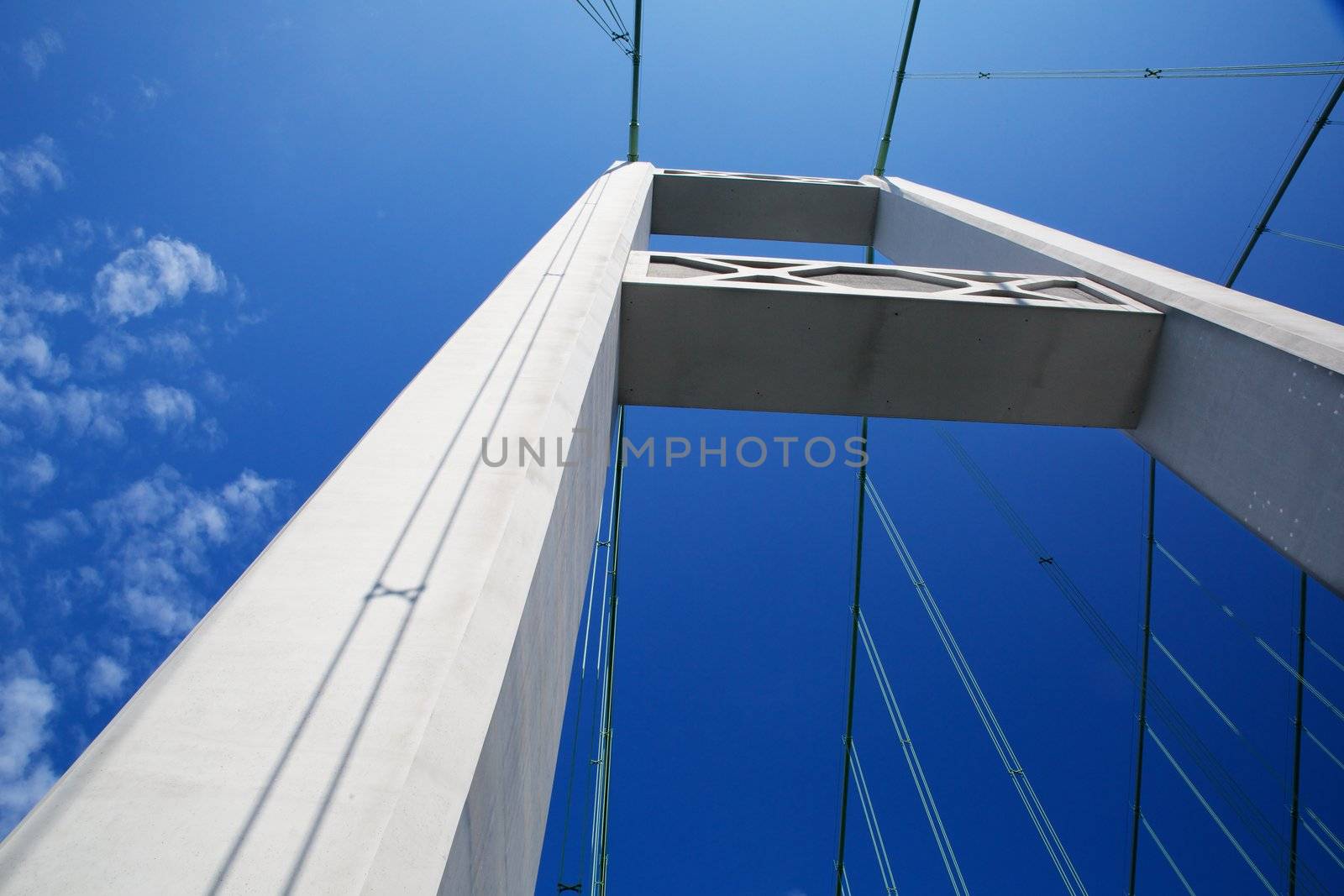 One of the Tacoma narrows bridge Towers against a nearly cloudless blue sky