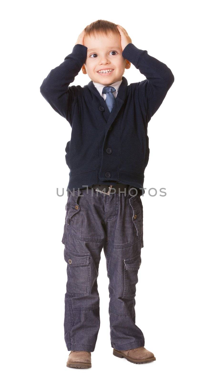 Full-length amazed or surprised child boy holds her head, isolated on white background