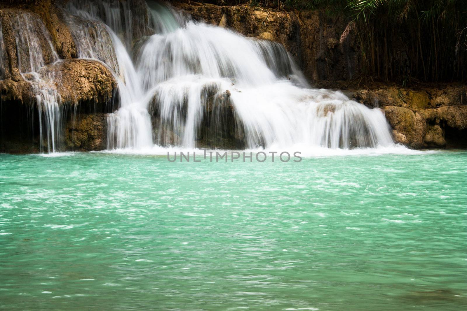 Waterfall and blue stream in the forest Laos