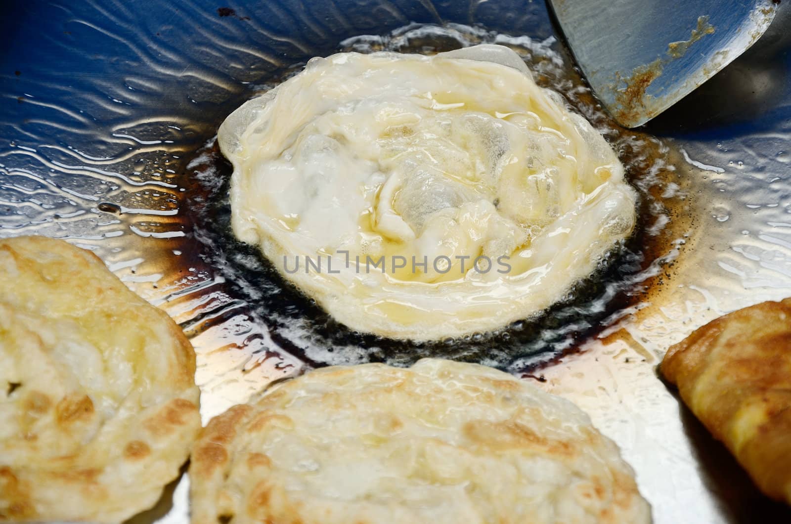 Roti or pancakes fring in some clarified butter