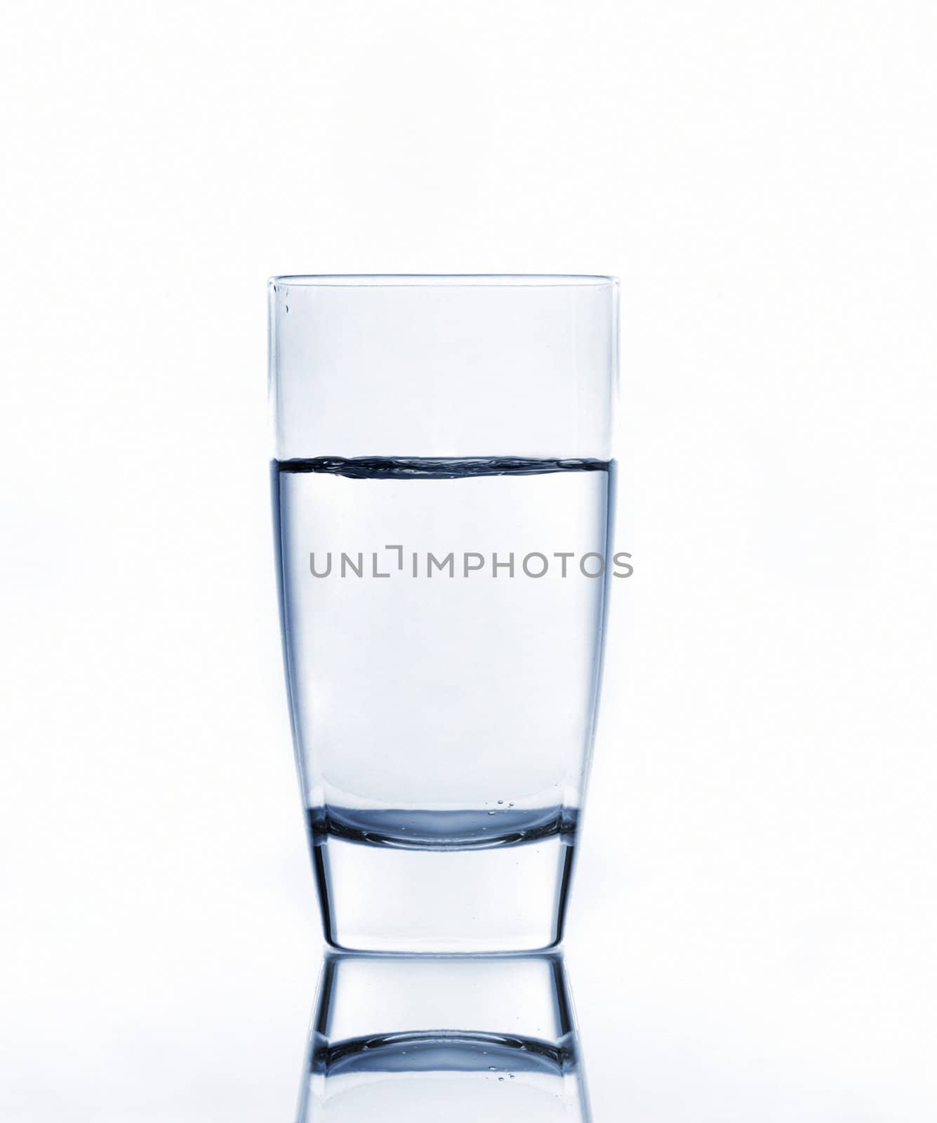 water on glass isolated on white background