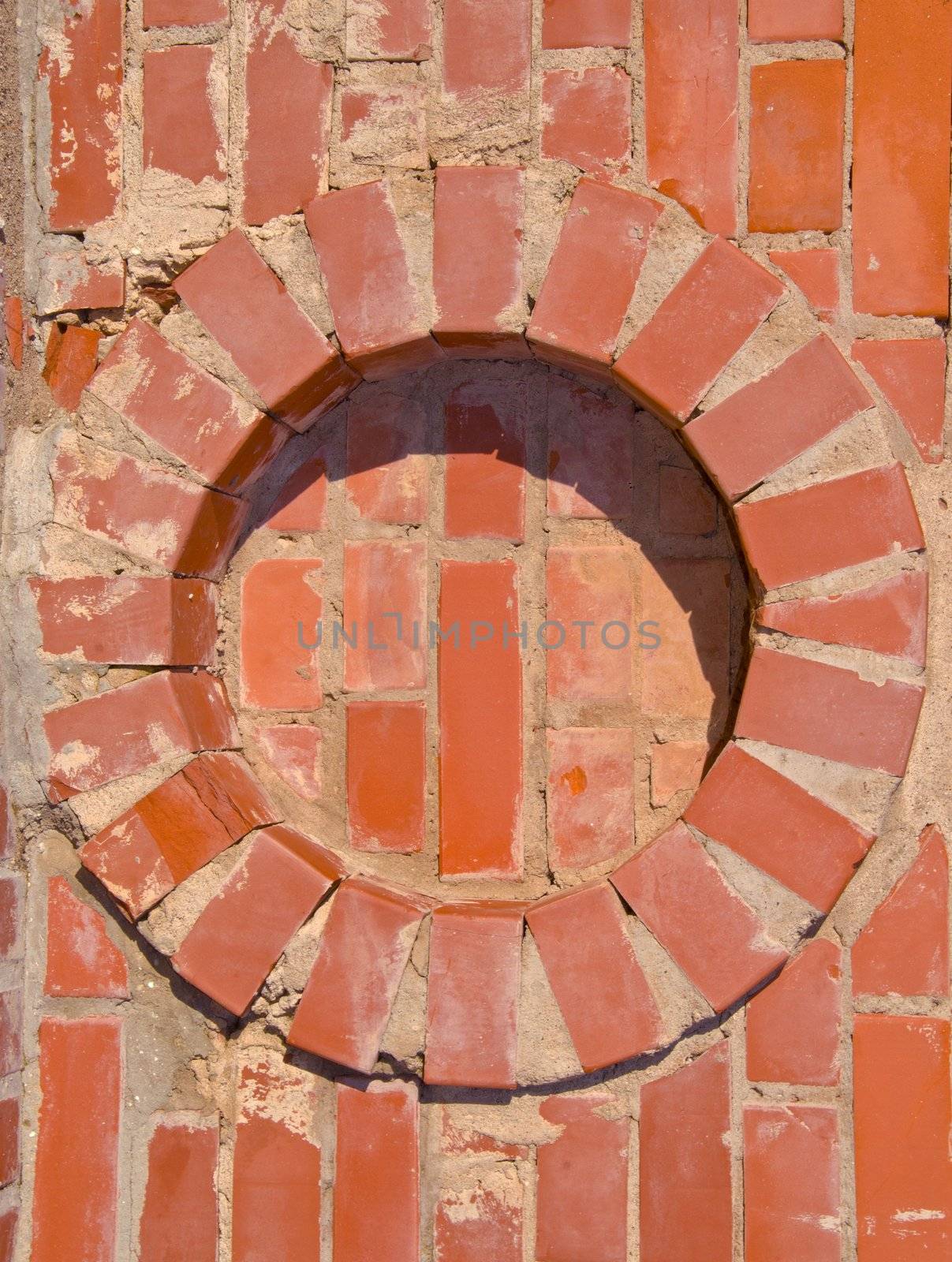 Red brick wall round circle details. Architectural backdrop.