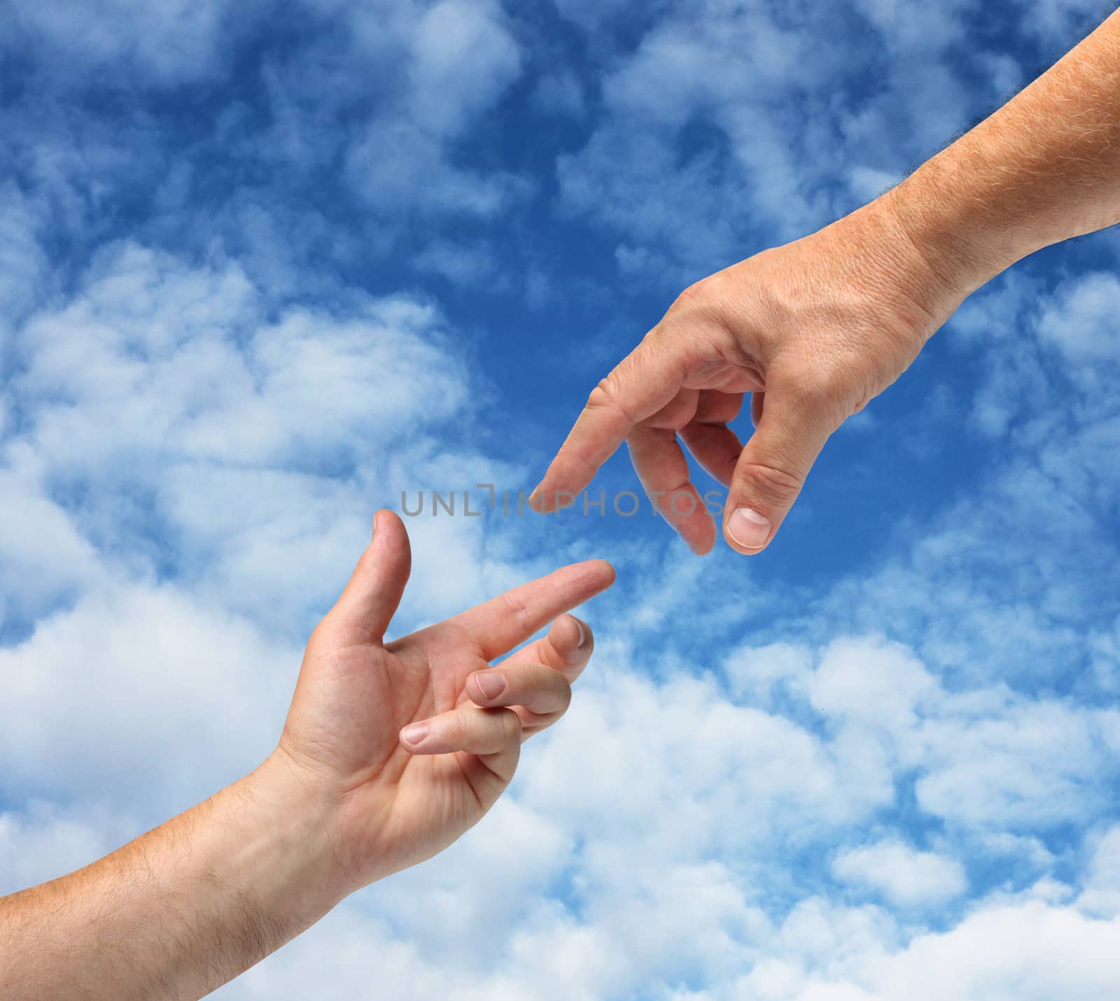 Two hands reaching towards each other blue sky background