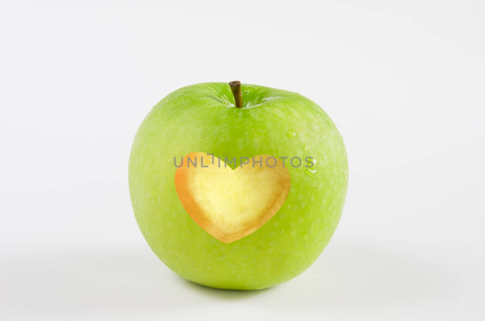 fresh green apple with heart shape