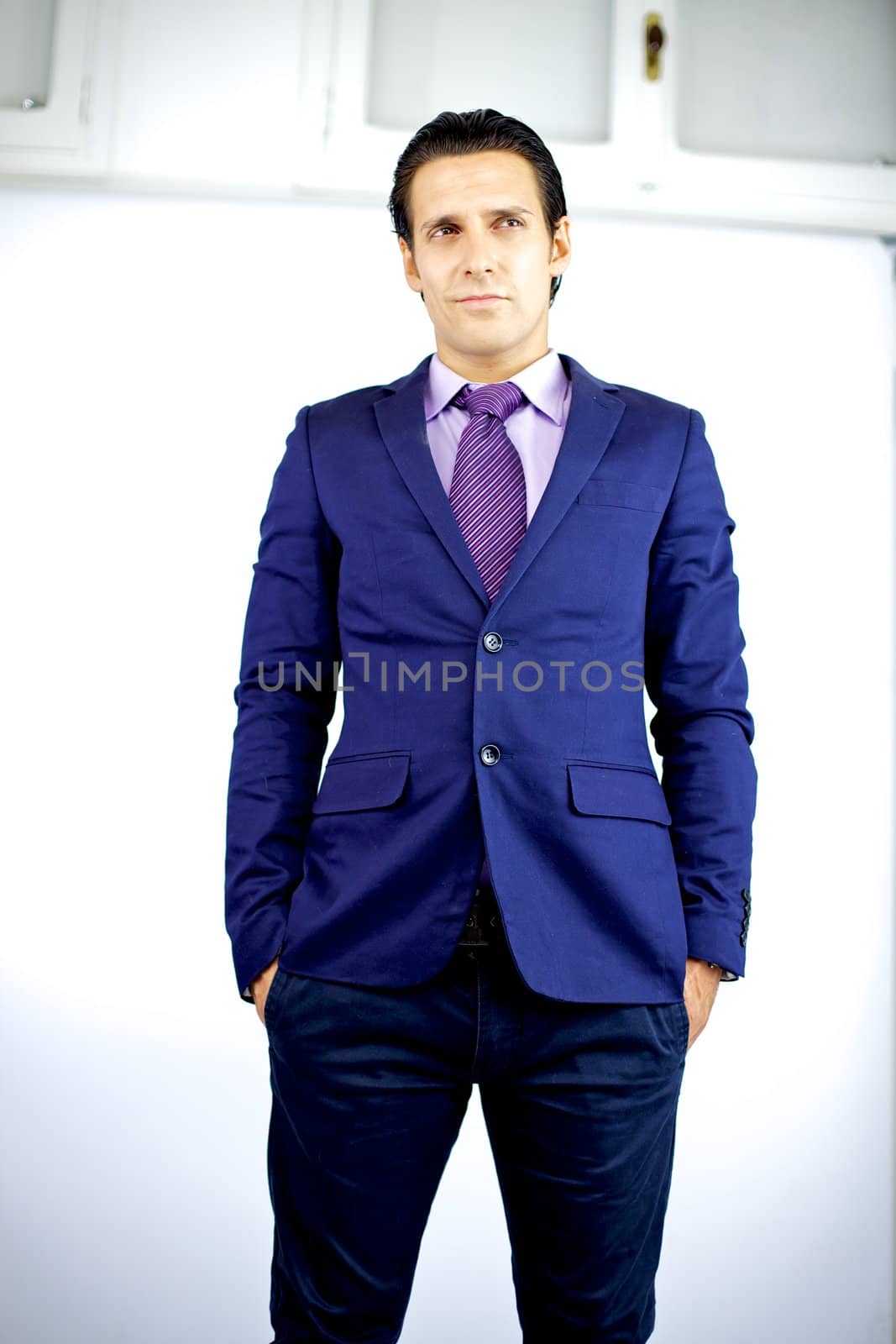attractive young cool businessman thinking standing