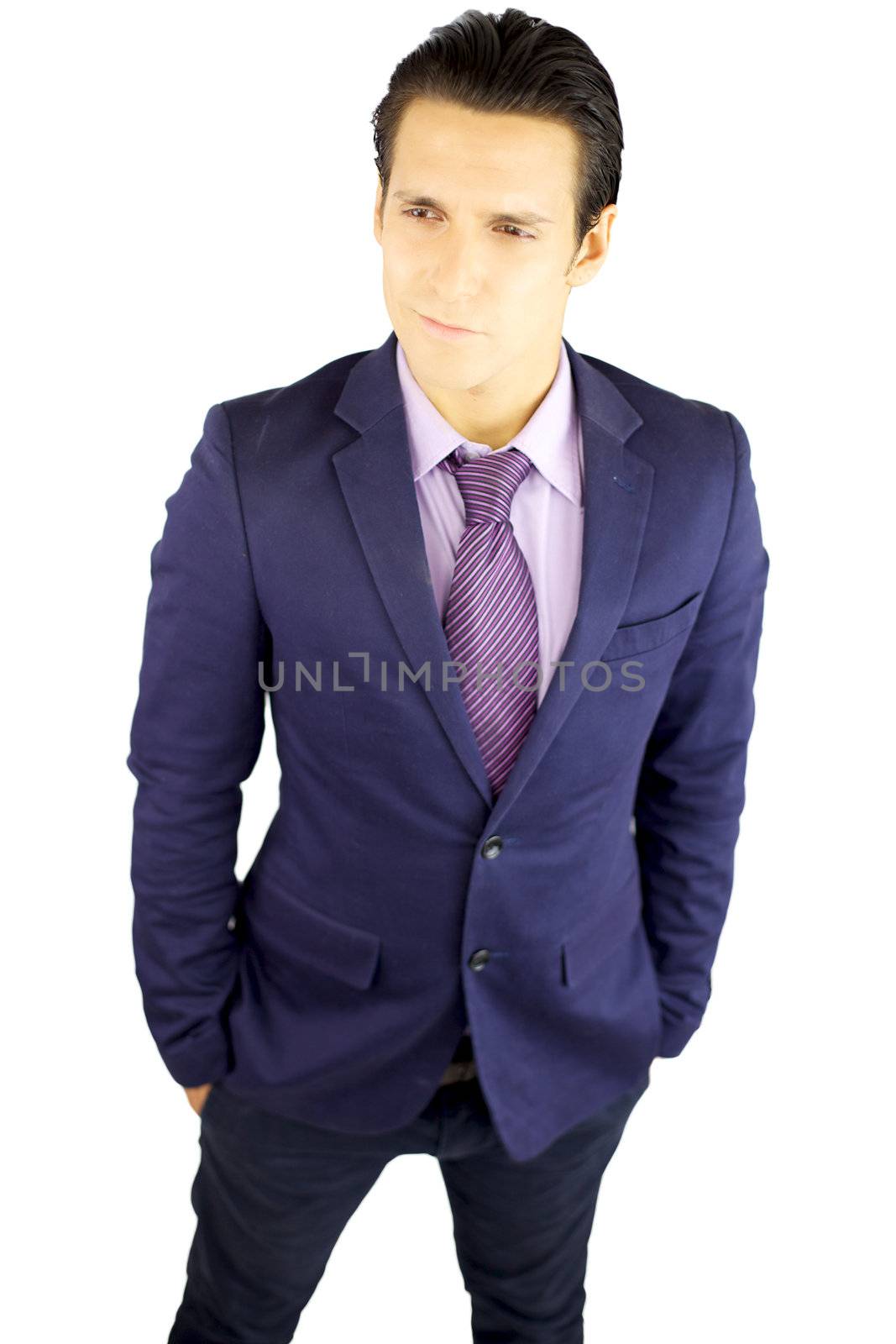 Good looking young businessman with smart smile posing