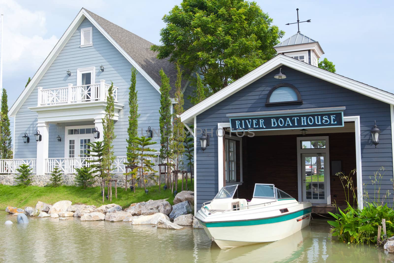 Boatshed on the River in blue house