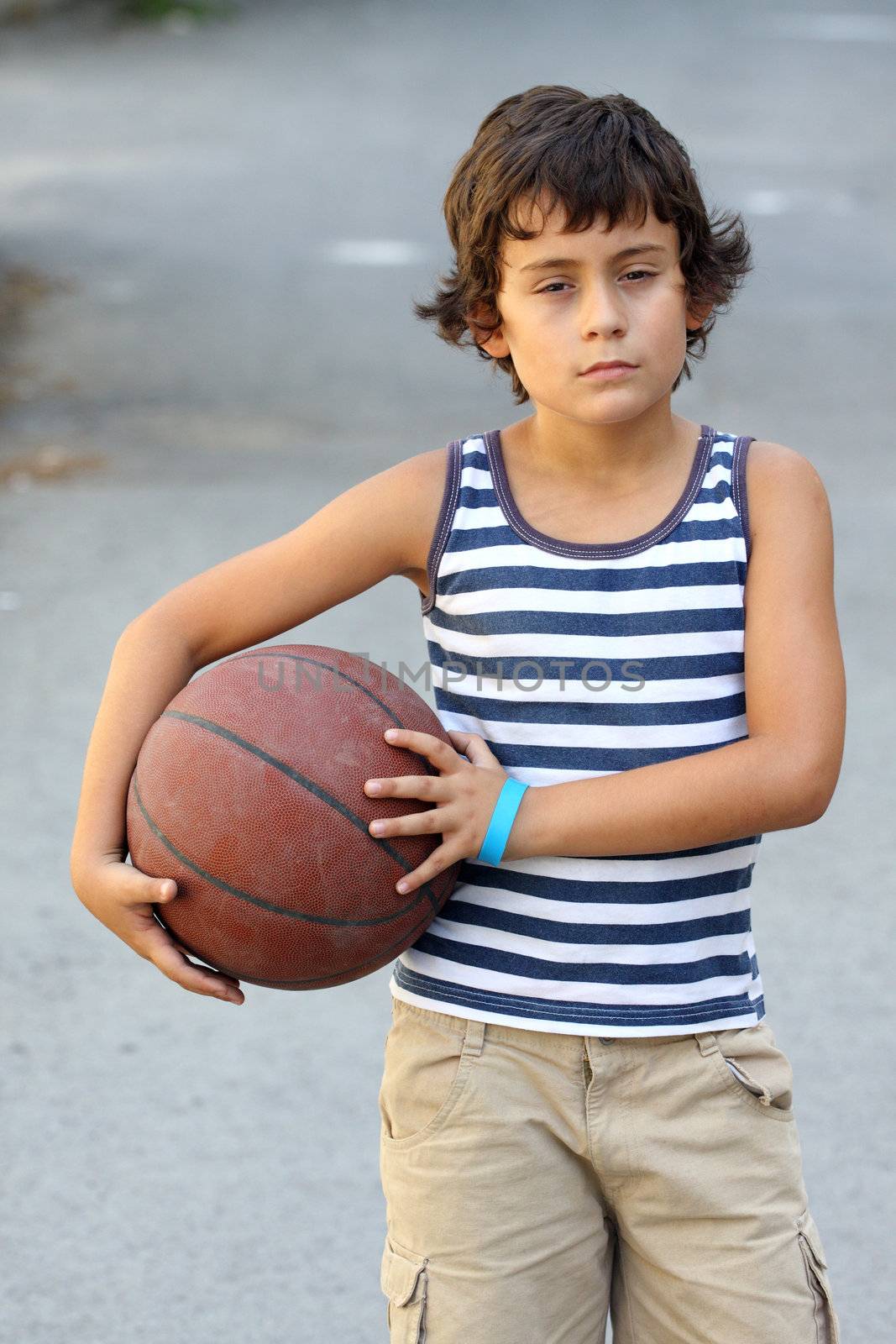 boy with basketball ball by alexkosev