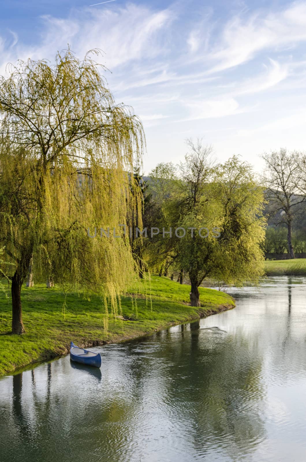 Scenic view on Krka river with blue canoe.