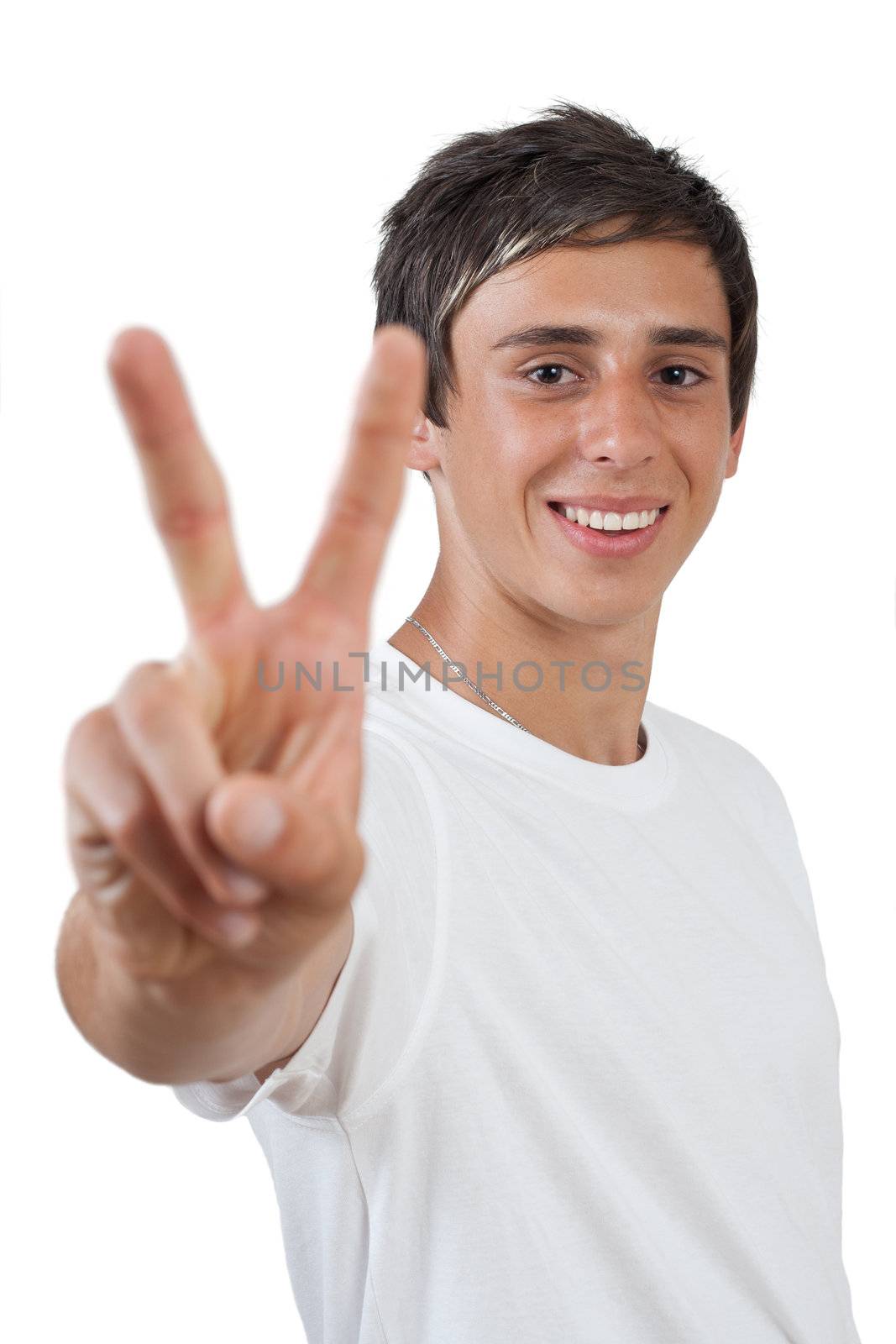 young swarthy man with  brown eyes shows peace / victory symbol on white background