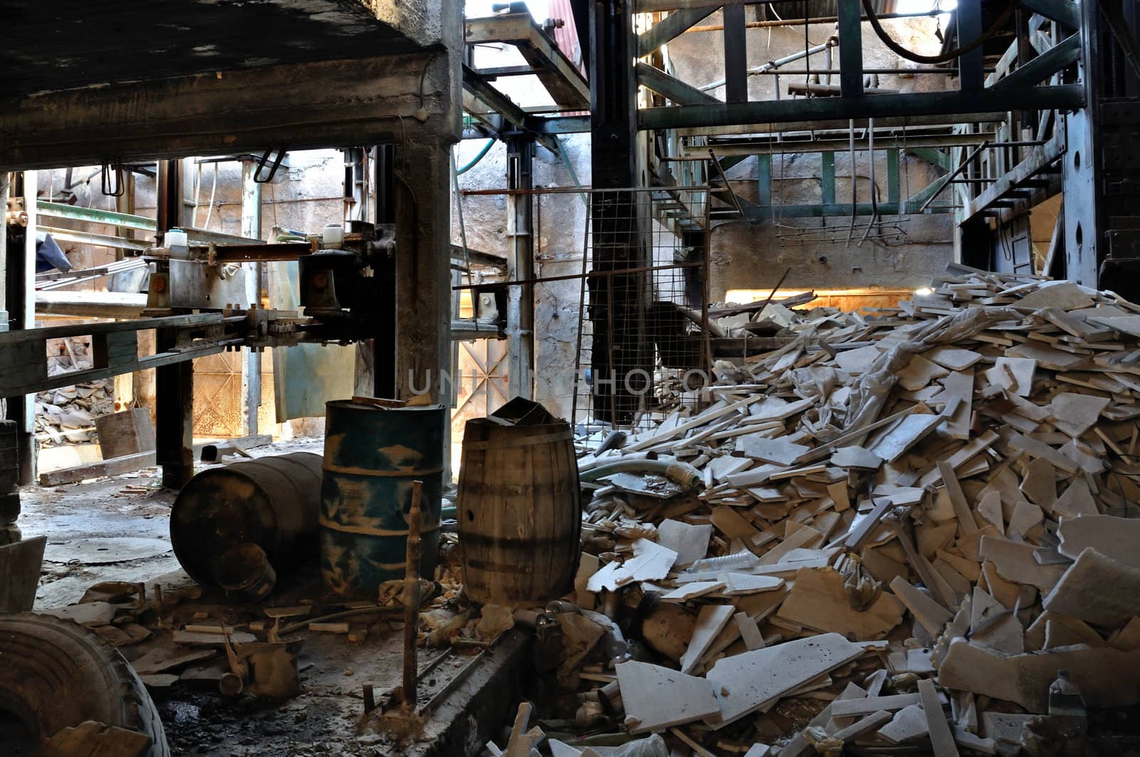 Abandoned marble processing factory interior. Industrial decay.