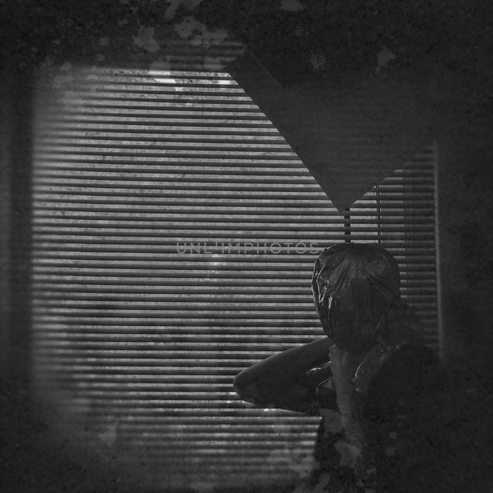Psychic draped with ectoplasm against window blinds in dark decayed interior. Black and white.