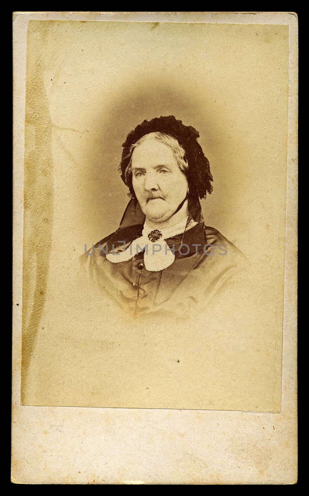Portrait of Victorian old lady with bonnet. Sourced from antique cabinet card vintage photograph created by E. Matthews, Islington, London UK, circa 1870.