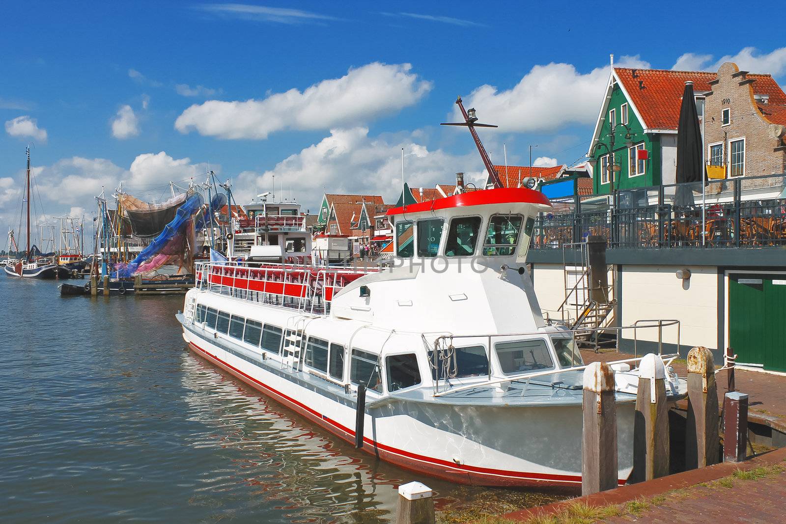 Tourist boat in the port of Volendam. Netherlands  by NickNick