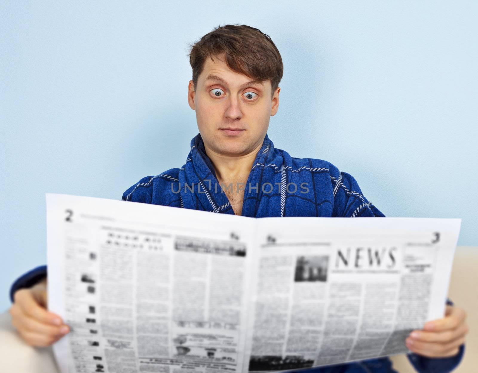 Man reads a newspaper with a admiration by pzaxe