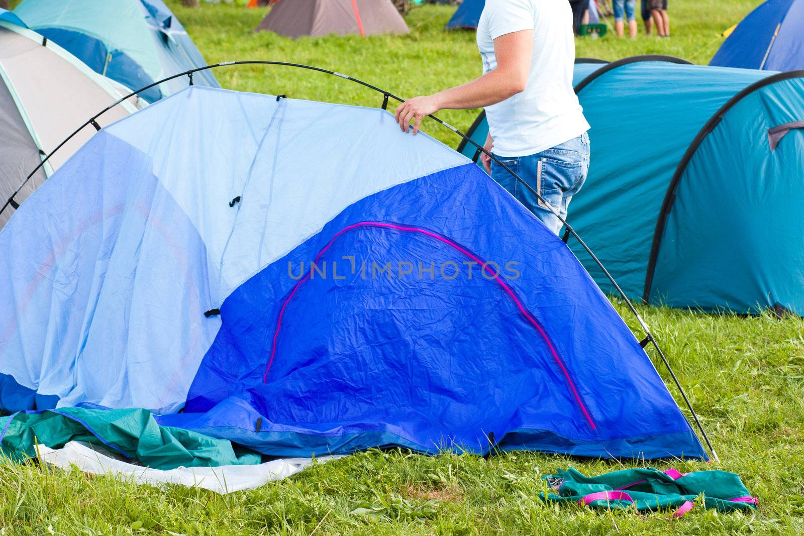 Putting up tent in a camping