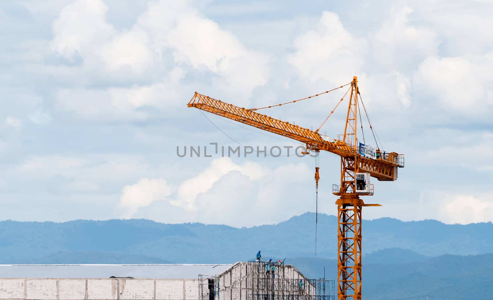 crane in construction site building  in evening time with cloud