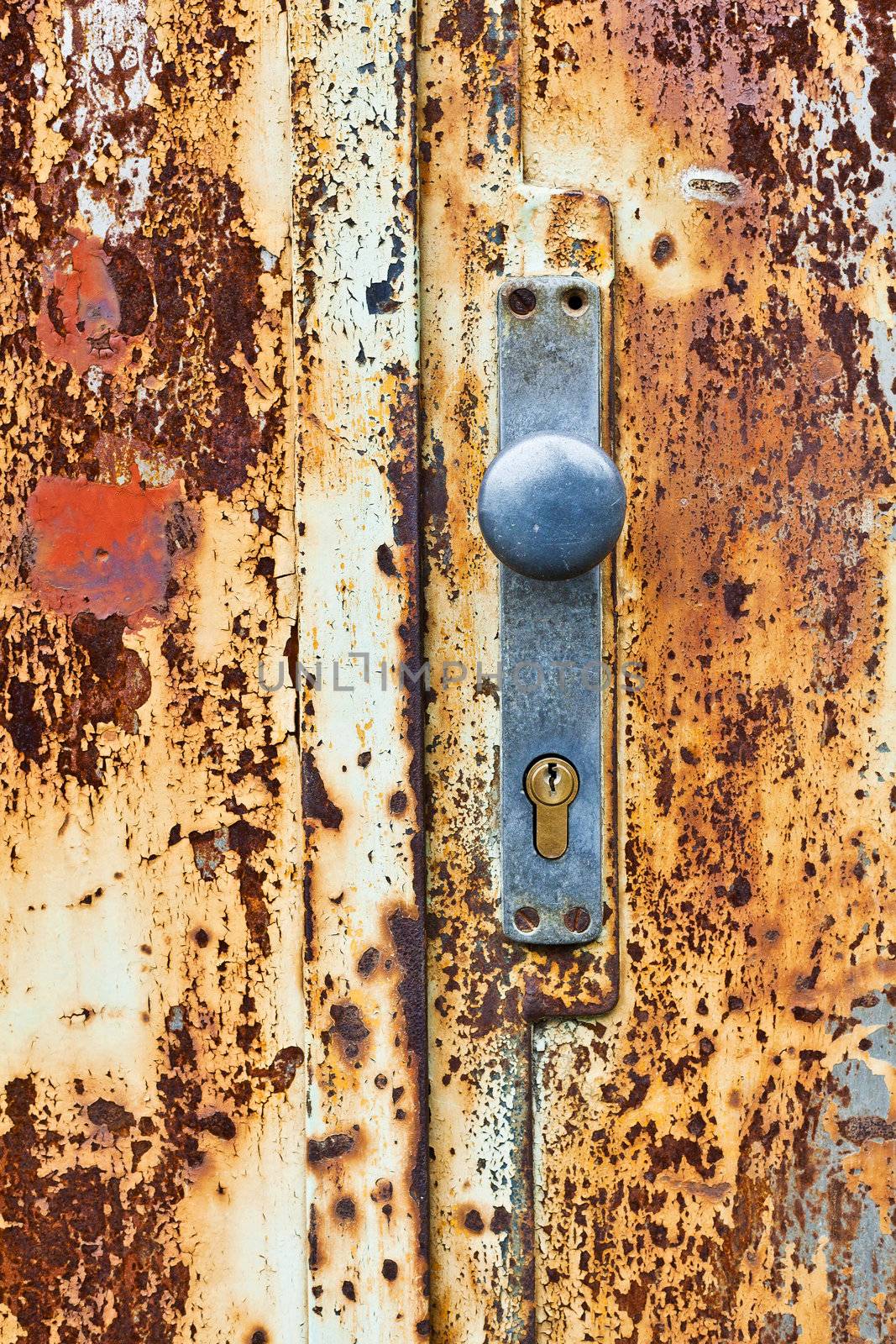 An old rusty gate door and lock