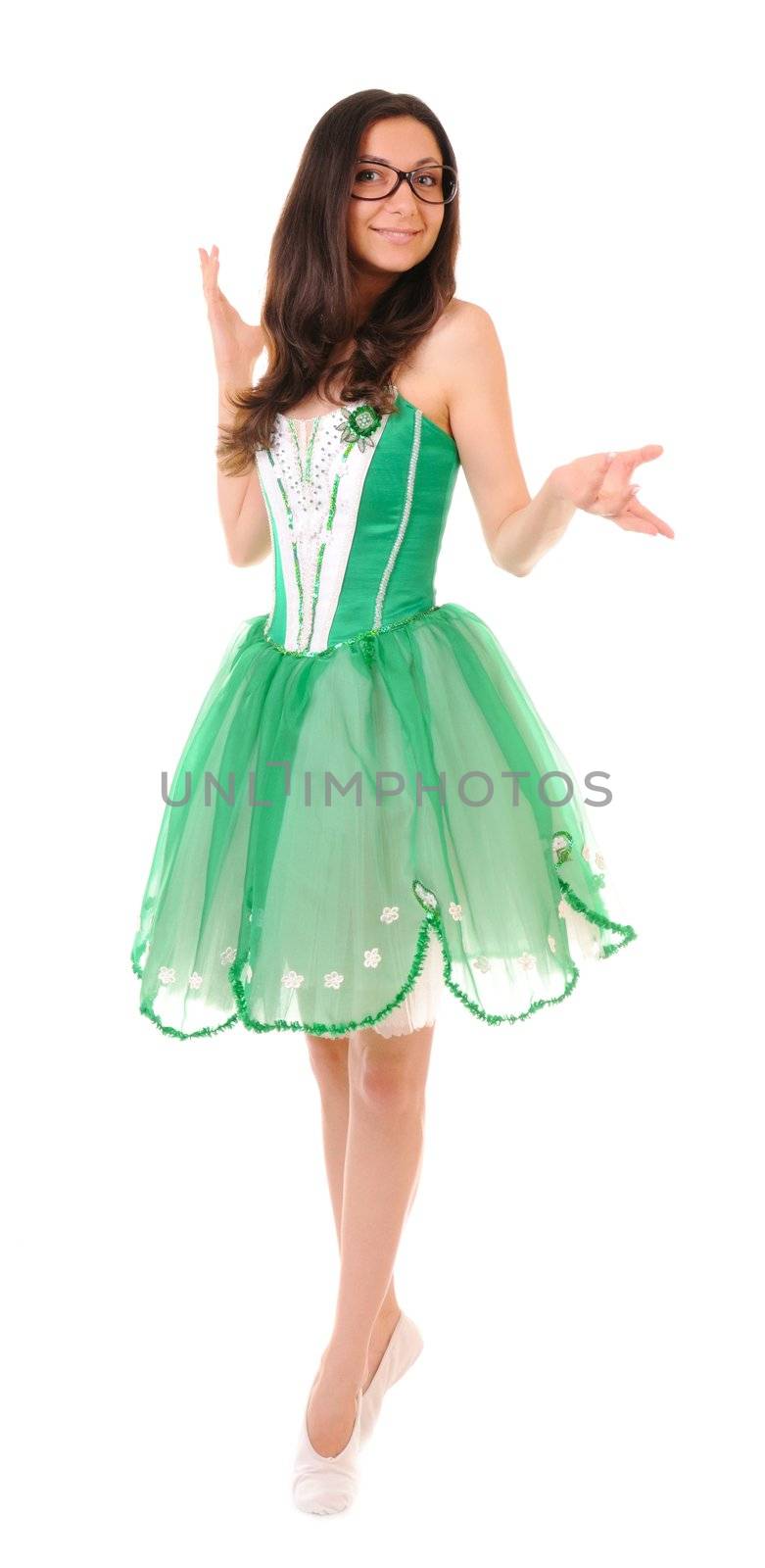 Dancing young woman in green ballet dress isolated on white background