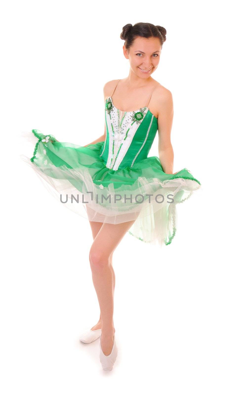 Dancing young woman in green ballet dress isolated on white background