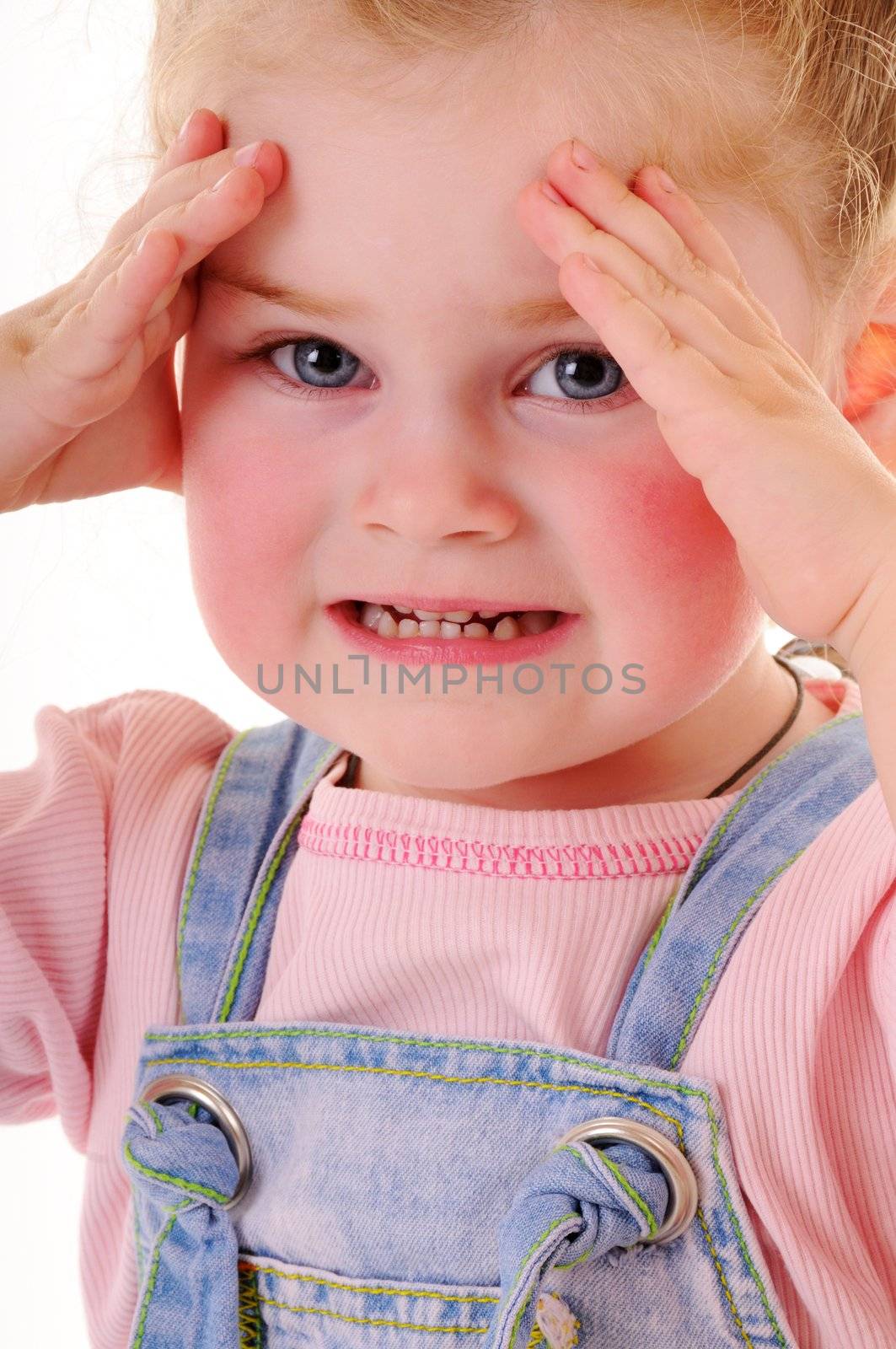 Aggressive small girl showing her teeth