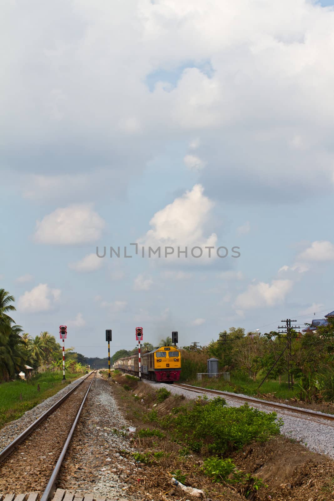 thai train running on railroad