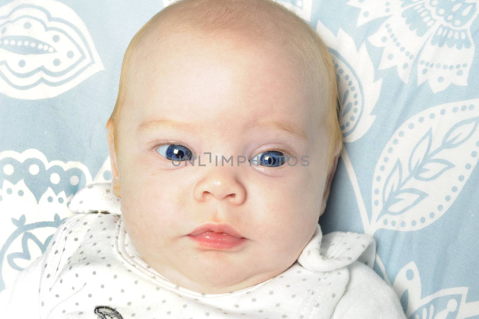 Beautiful baby girl with bright blue eyes