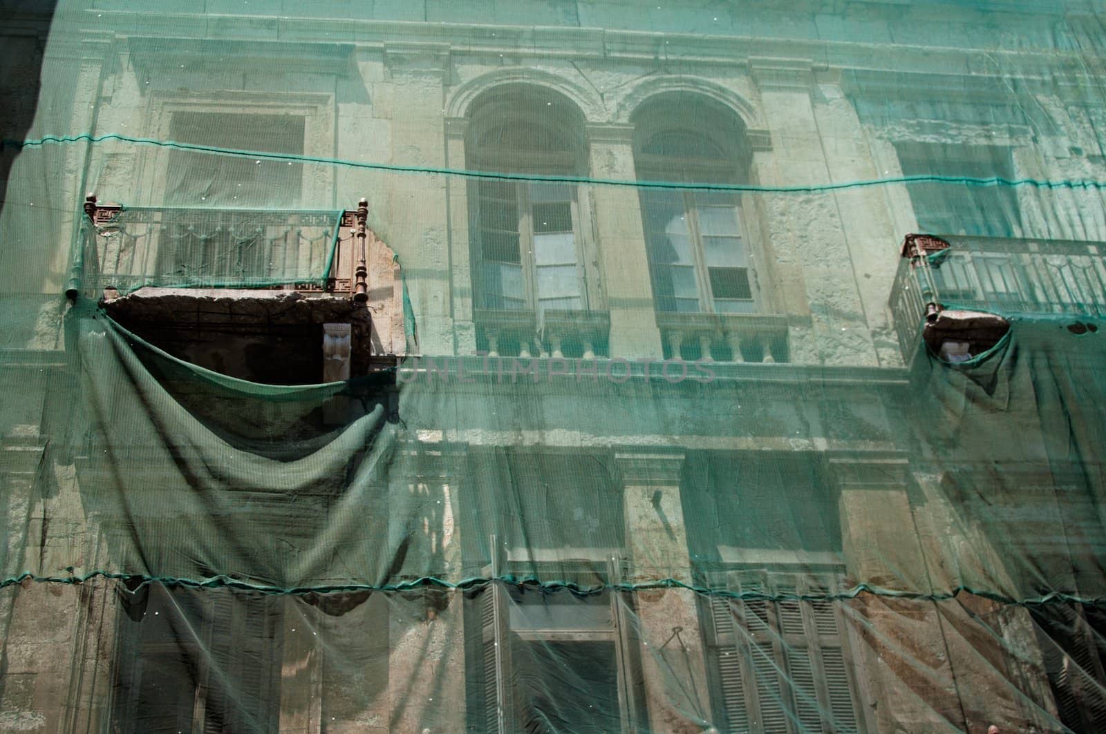 Scaffolding covering a luxurious old building under restoration on Crete Island, Greece