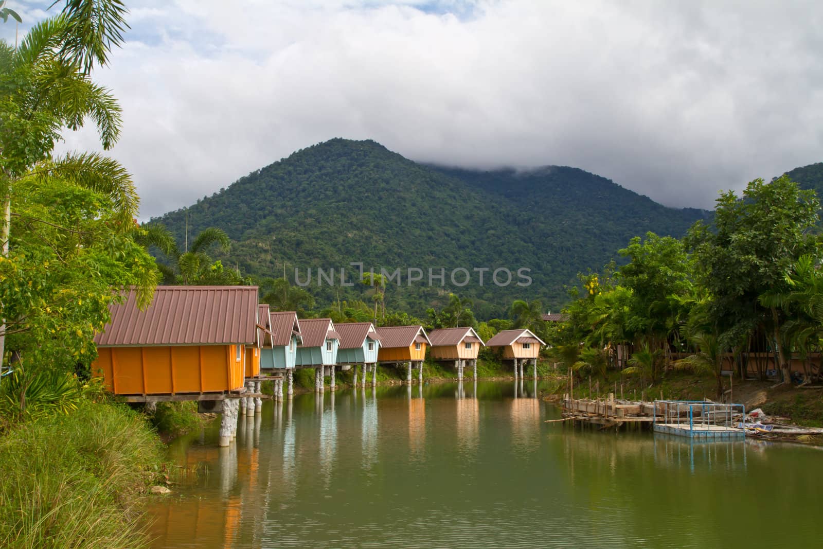 colorful resort and lake in front of the mountain