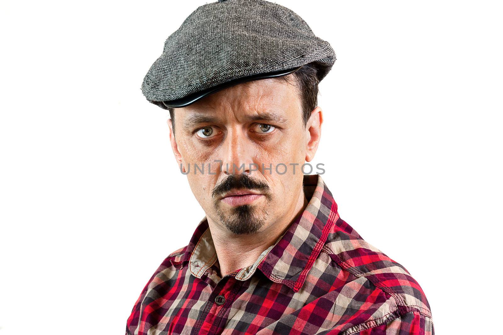 Portrait in Profile of young man wearing a cap, isolated on white background