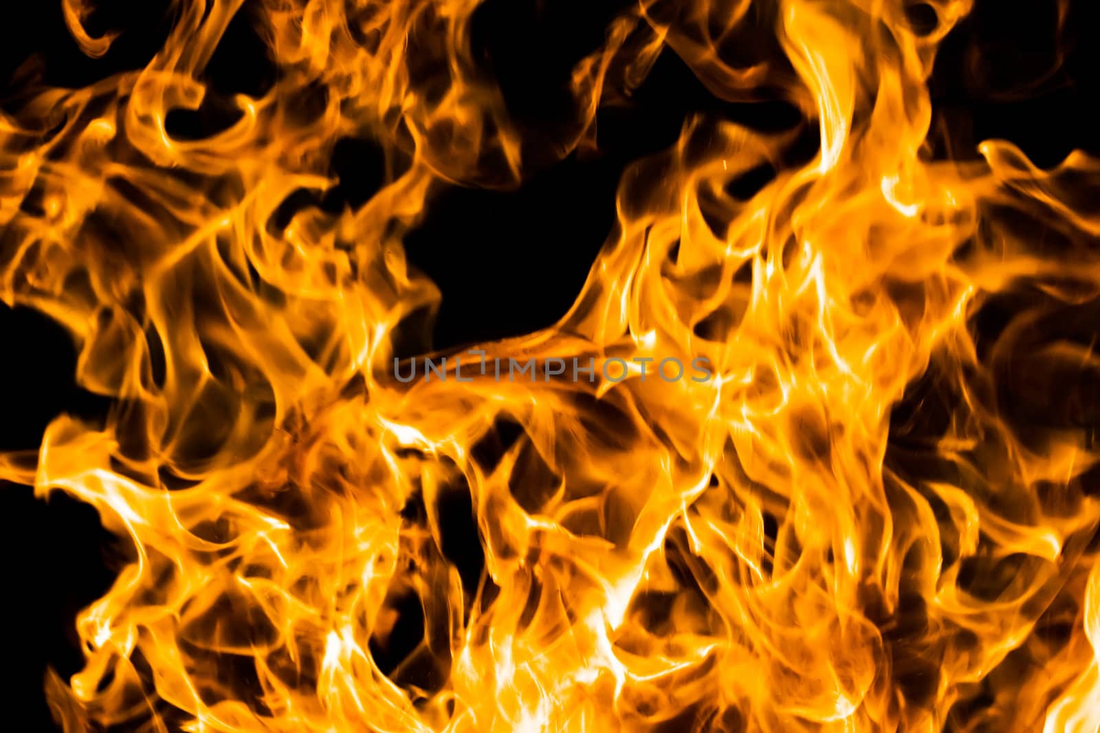 Orange flame burning on black background
