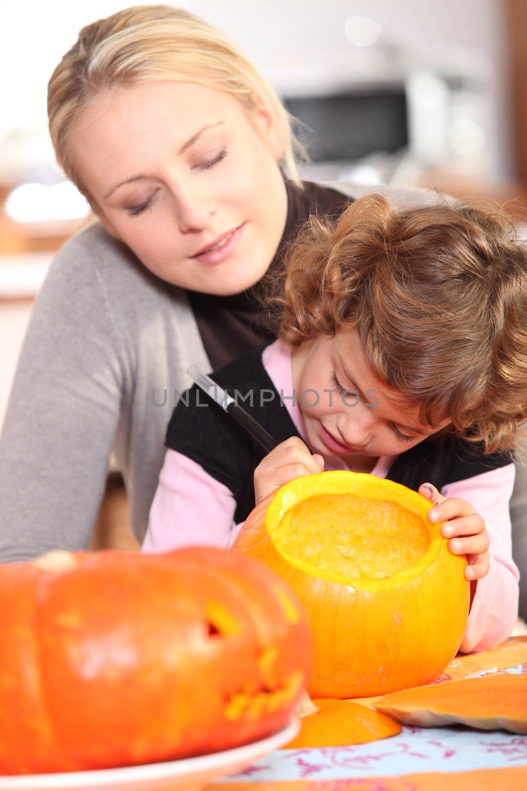 girl painting pumpkin by phovoir